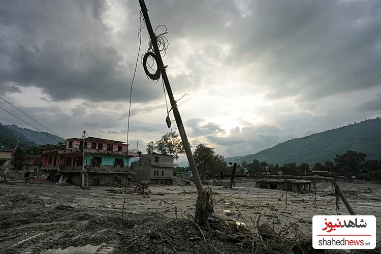 A damaged electric pole leans after flash flooding in the Devighat area of Nuwakot district in Nepal, 28 August, 2026